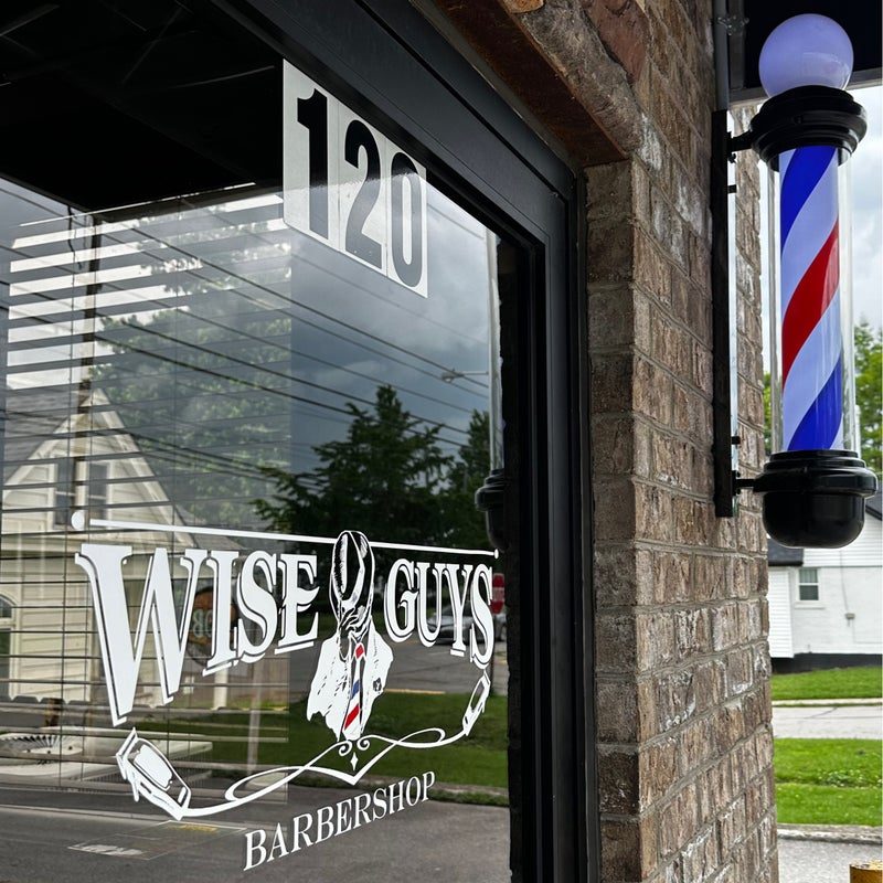 The WiseGuys Barbershop door at 833 Georgetown St, suite 120, with the barber pole
